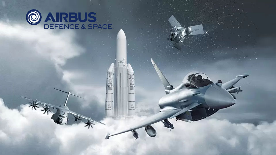 Airbus Defence and Space visual shows a rocket taking off, a satellite, a combat helicopter and a fighter jet in the air.